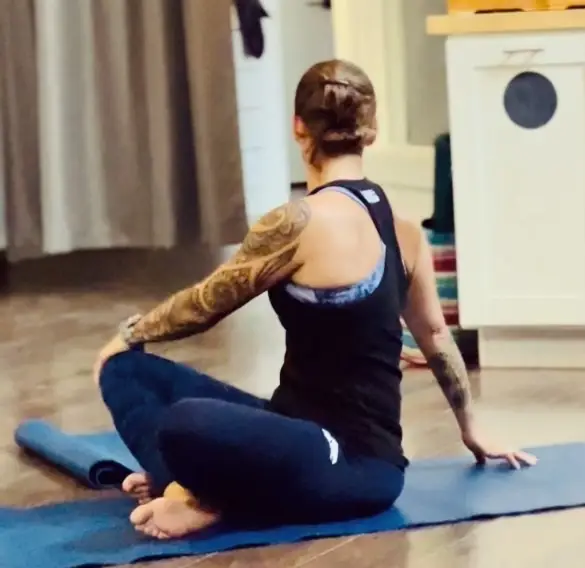 female practicing yoga at Middle Path CrossFit gym in kalispell